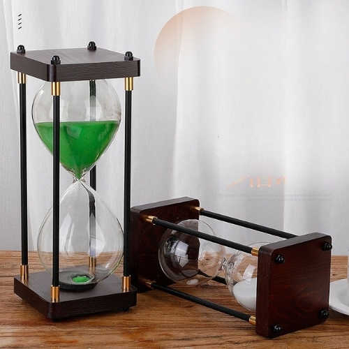Vintage metal frame glass hourglass timer with retro decorative design Vintage metal frame glass hourglass timer with retro decorative design